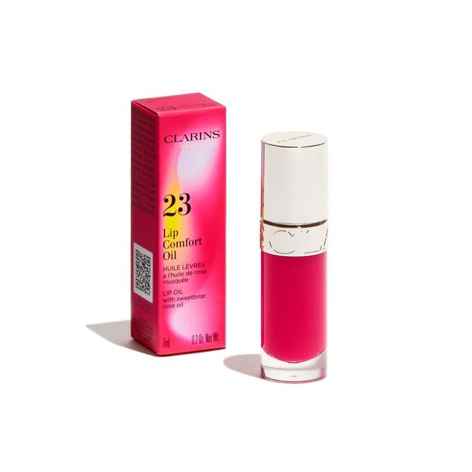 Plan produit de l’Huile Confort Lèvres rose Clarins issue de la collection Pouvoir des Couleurs, présentée avec son emballage